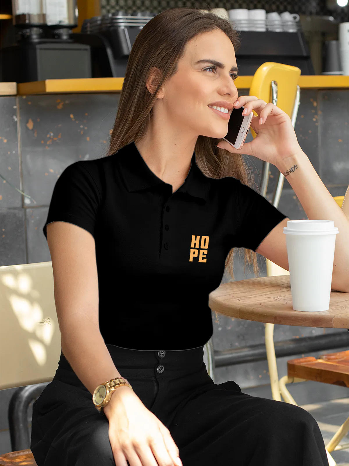 Model wearing Women's Black Polo T-shirt with 'Hope' design, offering effortless style and premium comfort