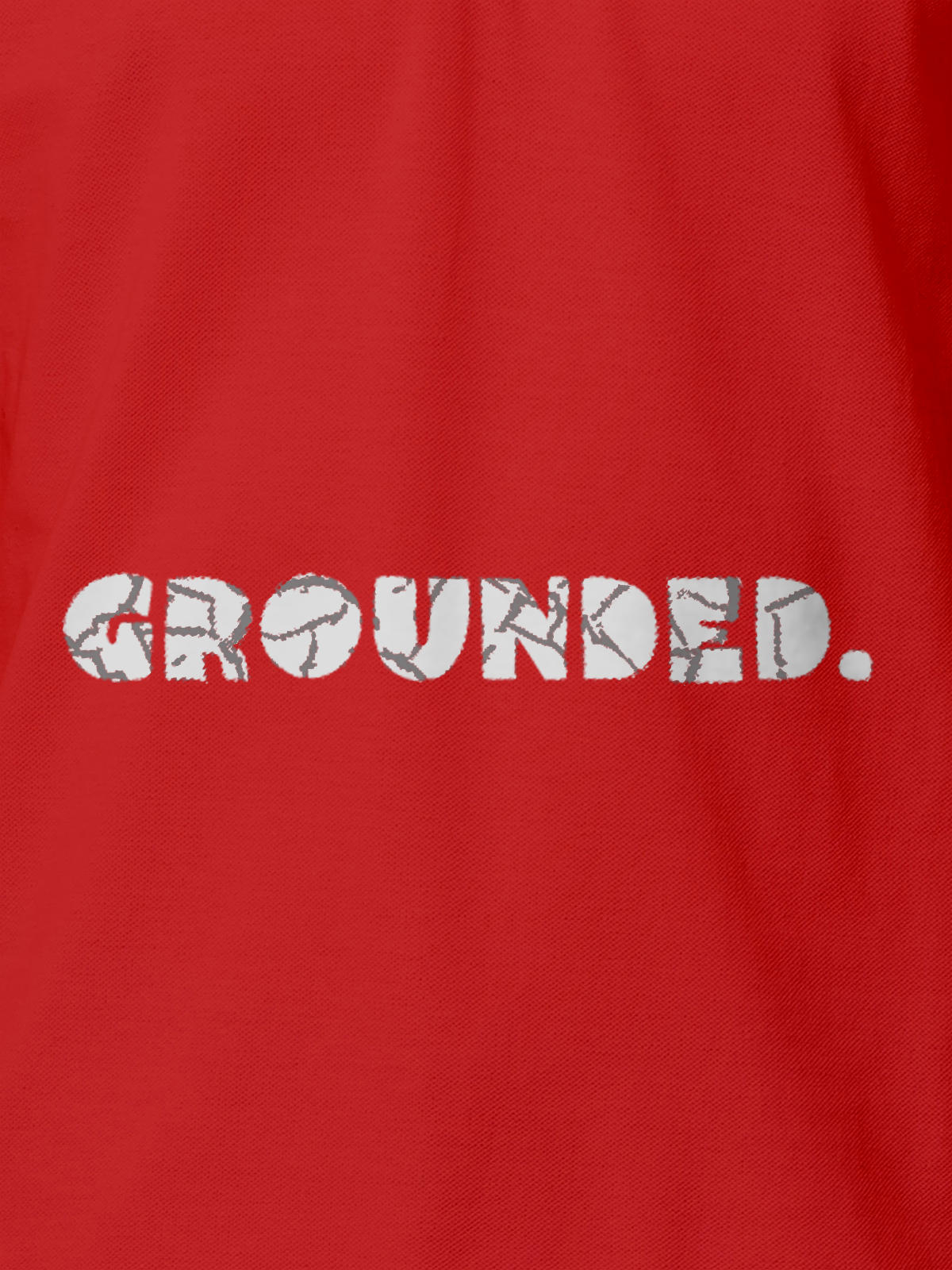 Close up of 'Grounded' design on Men's Red Polo T-shirt, highlighting intricate details and vibrant print.