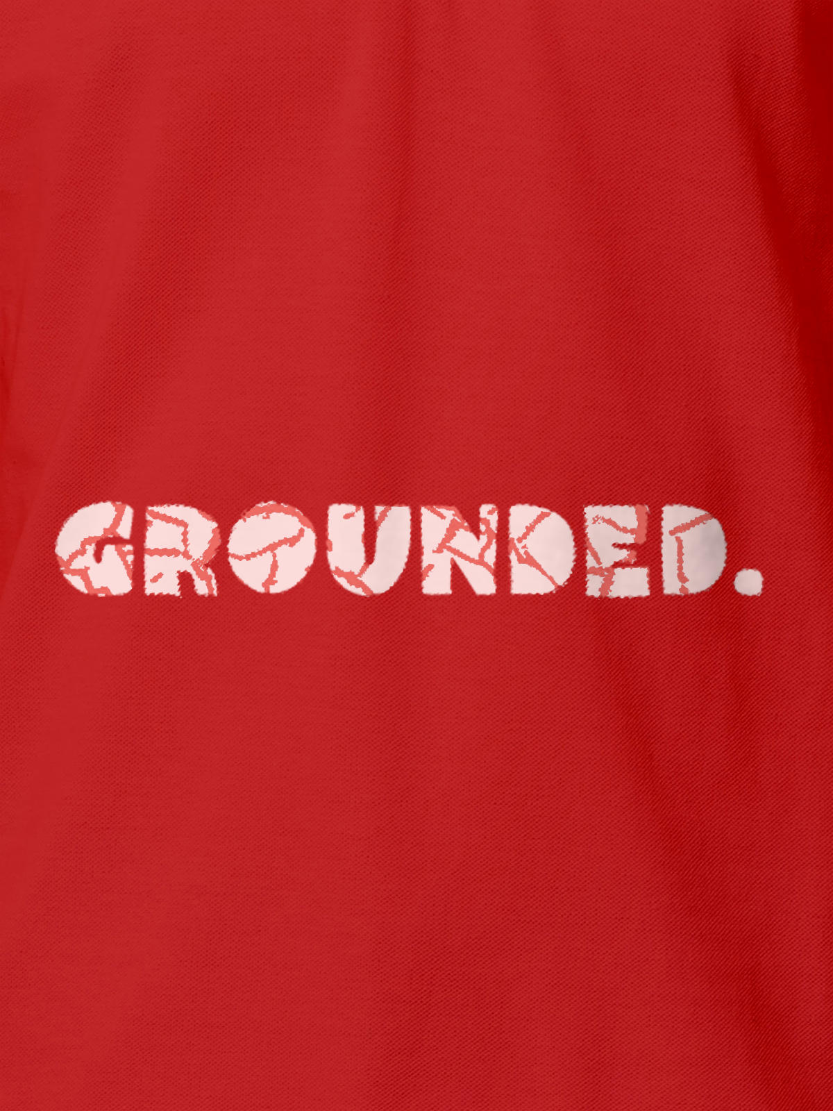Close up of 'Grounded' design on Men's Red Polo T-shirt, highlighting intricate details and vibrant print.