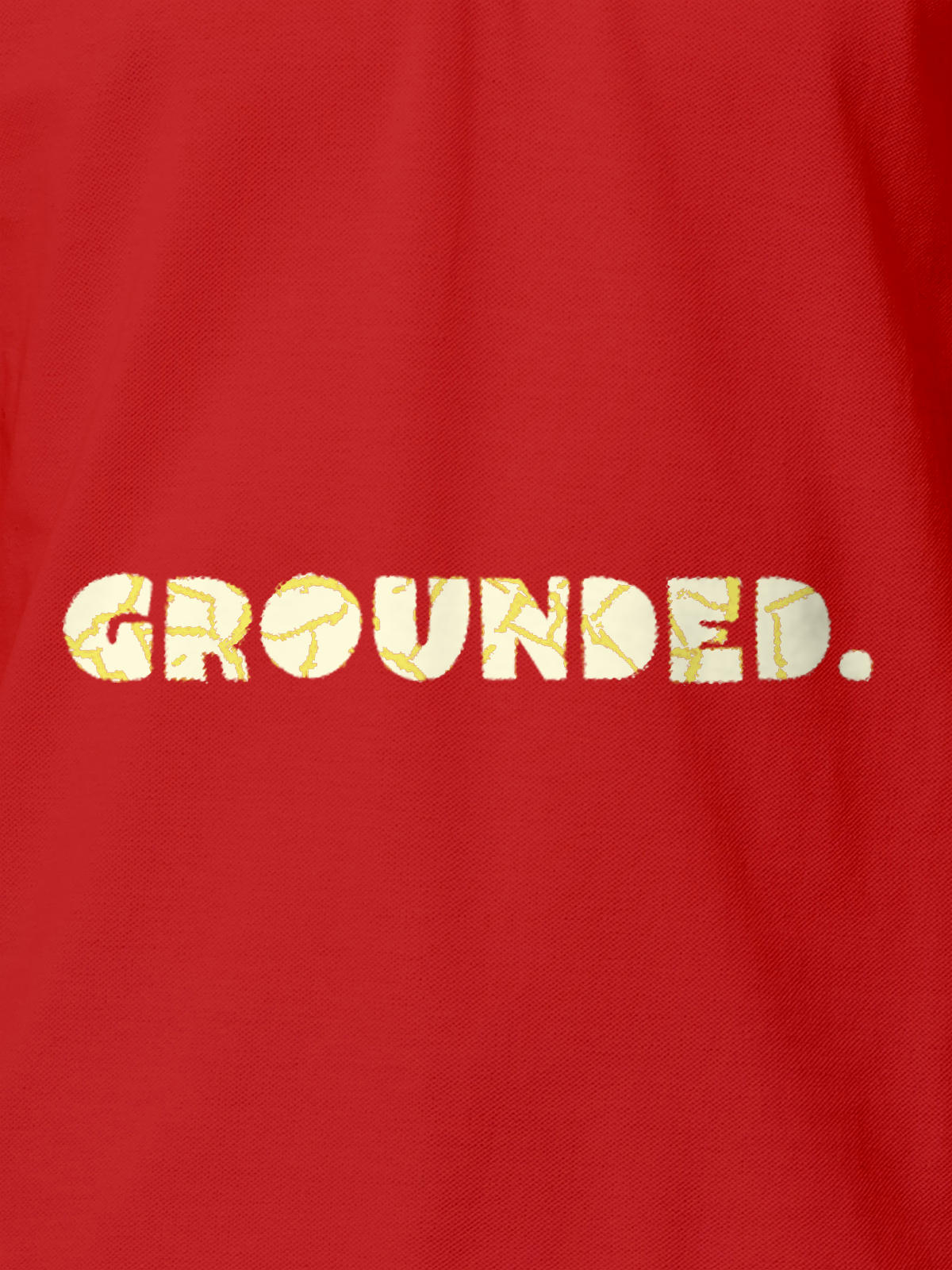 Close up of 'Grounded' design on Men's Red Polo T-shirt, highlighting intricate details and vibrant print.