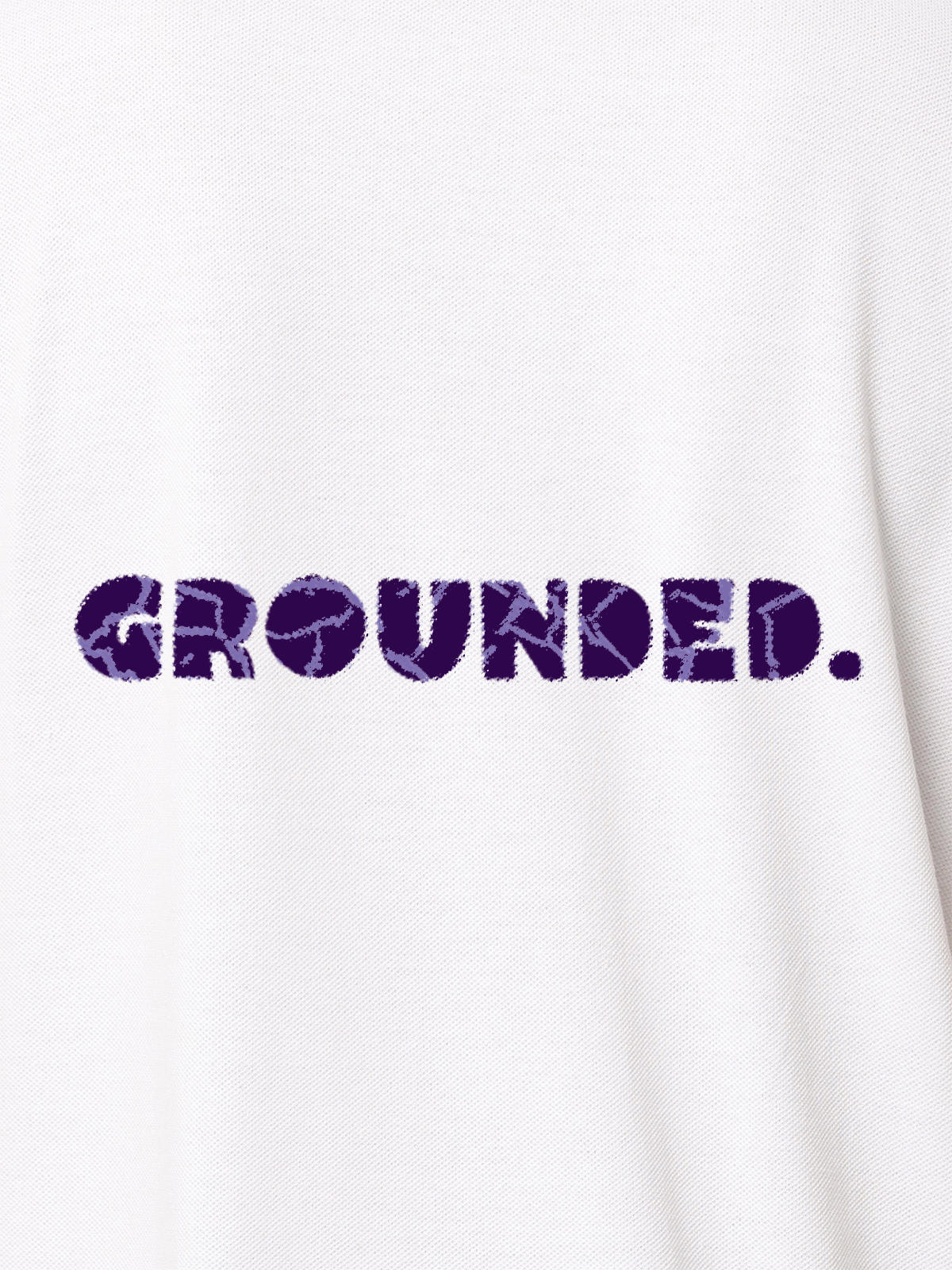 Close up of 'Grounded' design on Women's White Polo T-shirt, highlighting intricate details and vibrant print.
