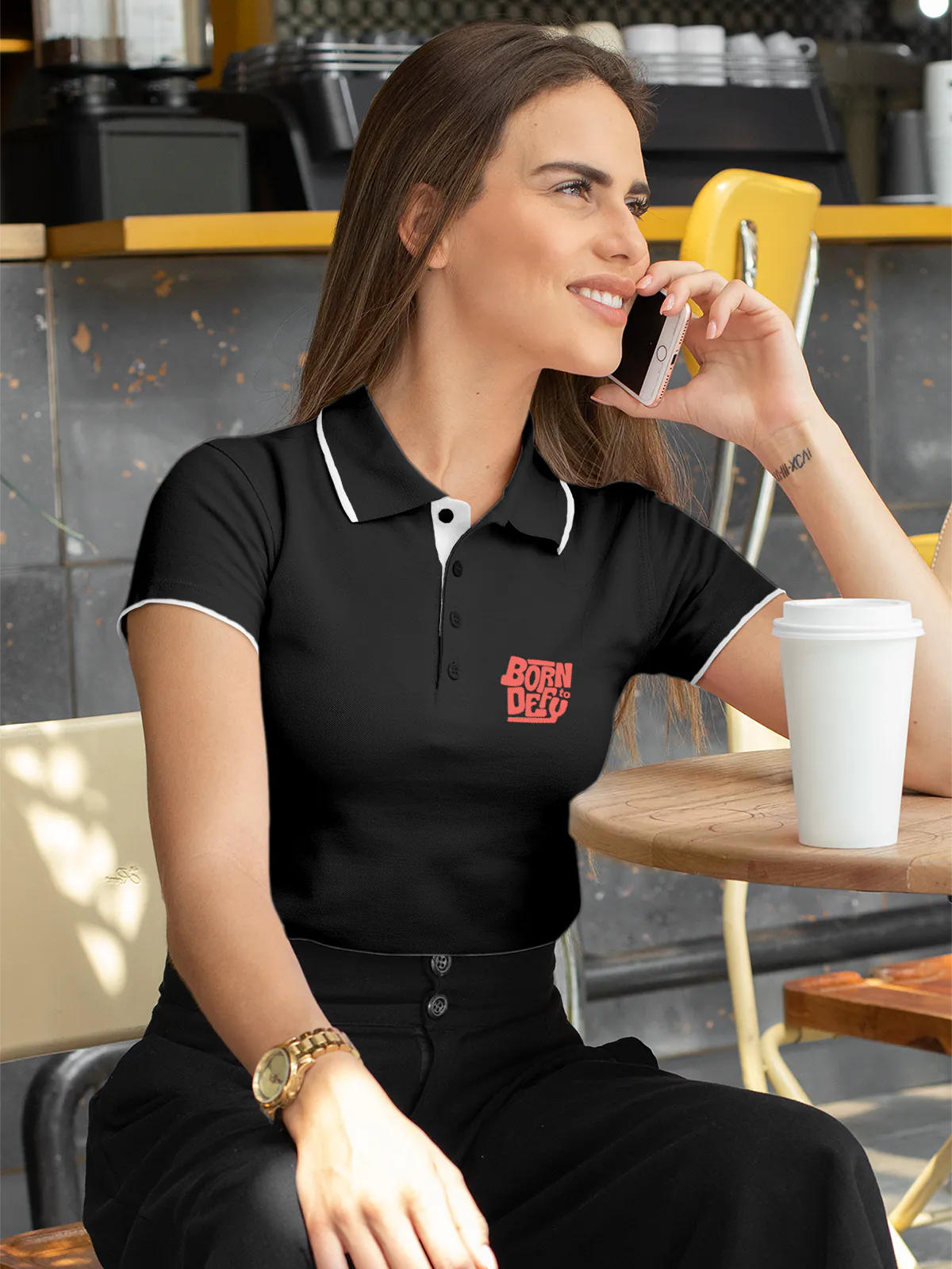 Model wearing Women's Dark Grey Polo T-shirt with 'Born To Defy' design, offering effortless style and premium comfort