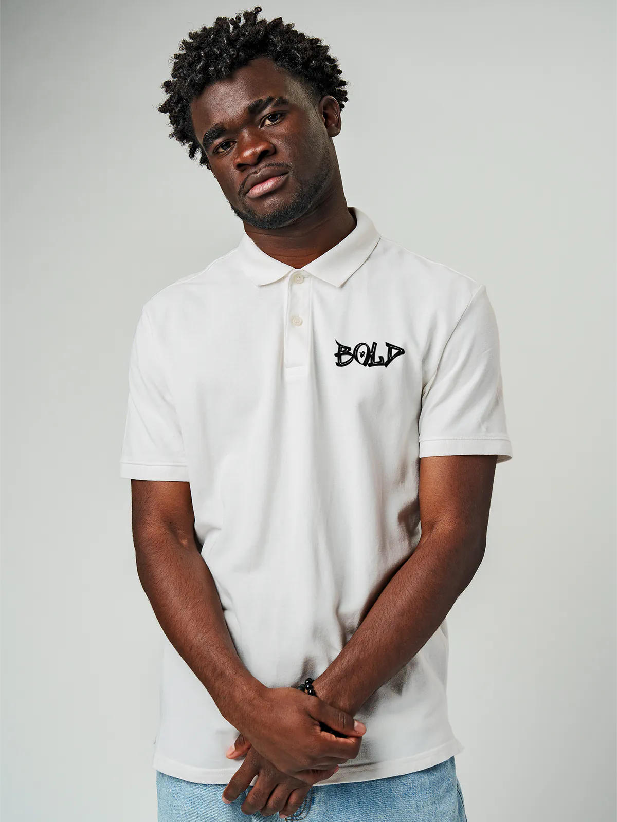 Model wearing Men's White Polo T-shirt with Bold, offering effortless style and premium comfort