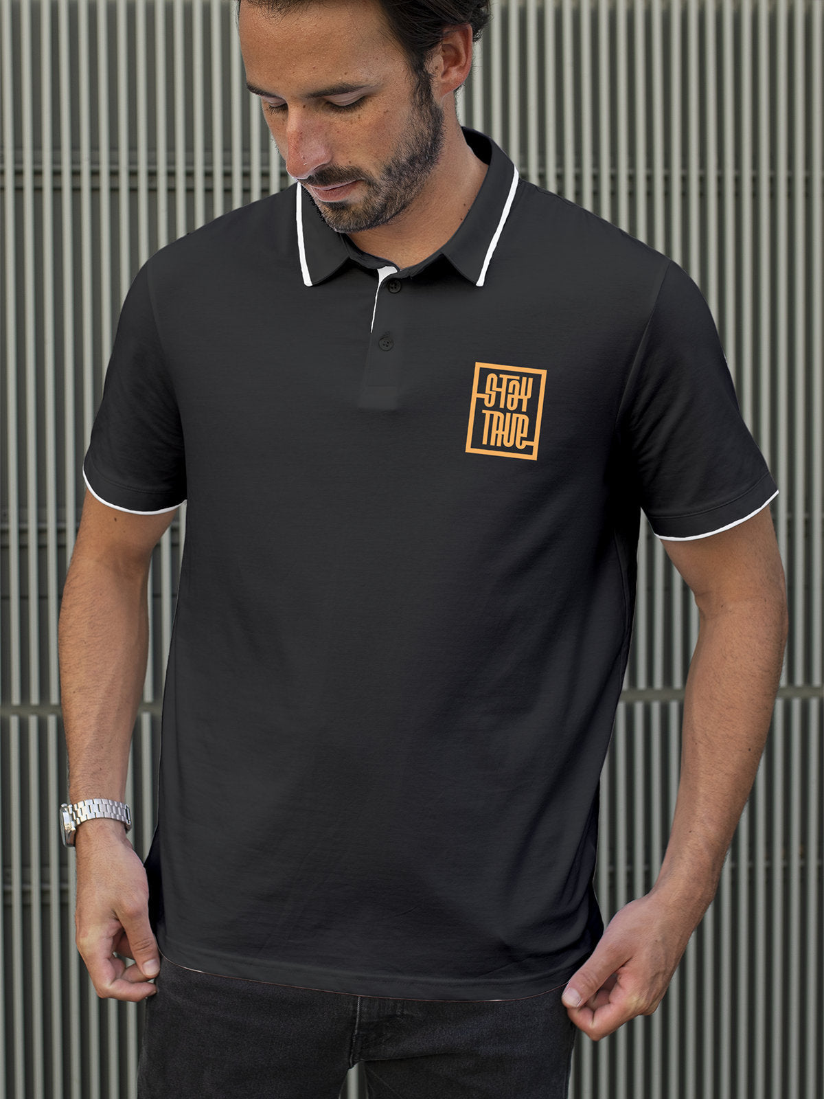 Model wearing Men's Dark Grey Polo T-shirt with Stay True, offering effortless style and premium comfort