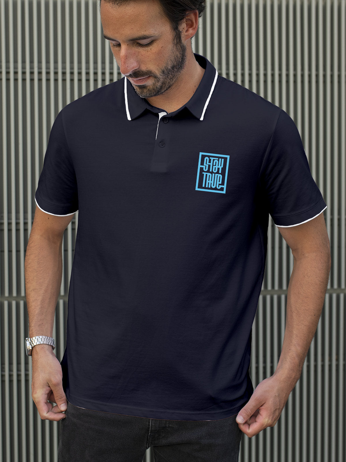 Fighterhero Polos: Model wearing Men's Navy Blue Polo T-shirt with 'Stay True' design
