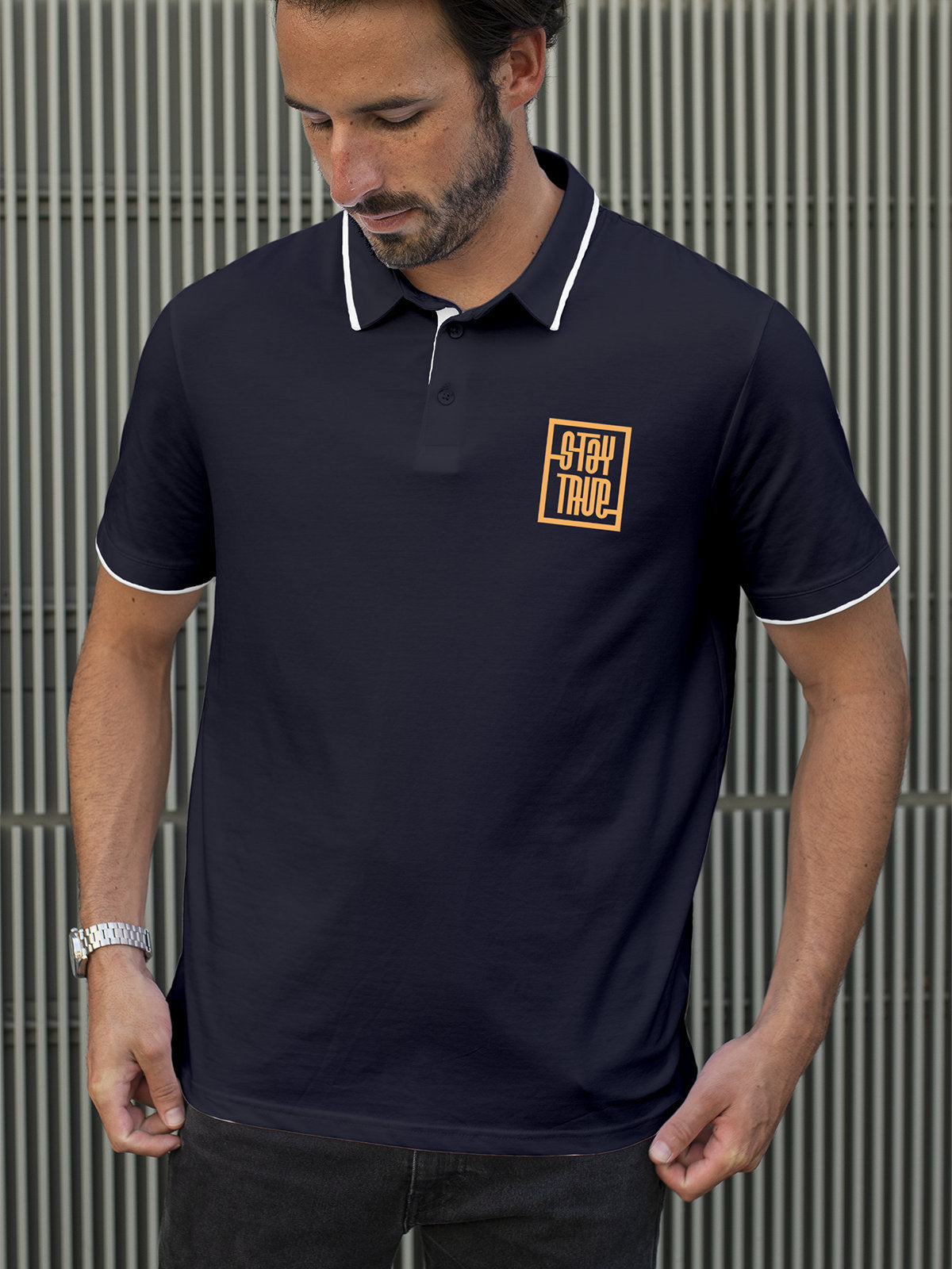 Model wearing Men's Navy Blue Polo T-shirt with Stay True, offering effortless style and premium comfort