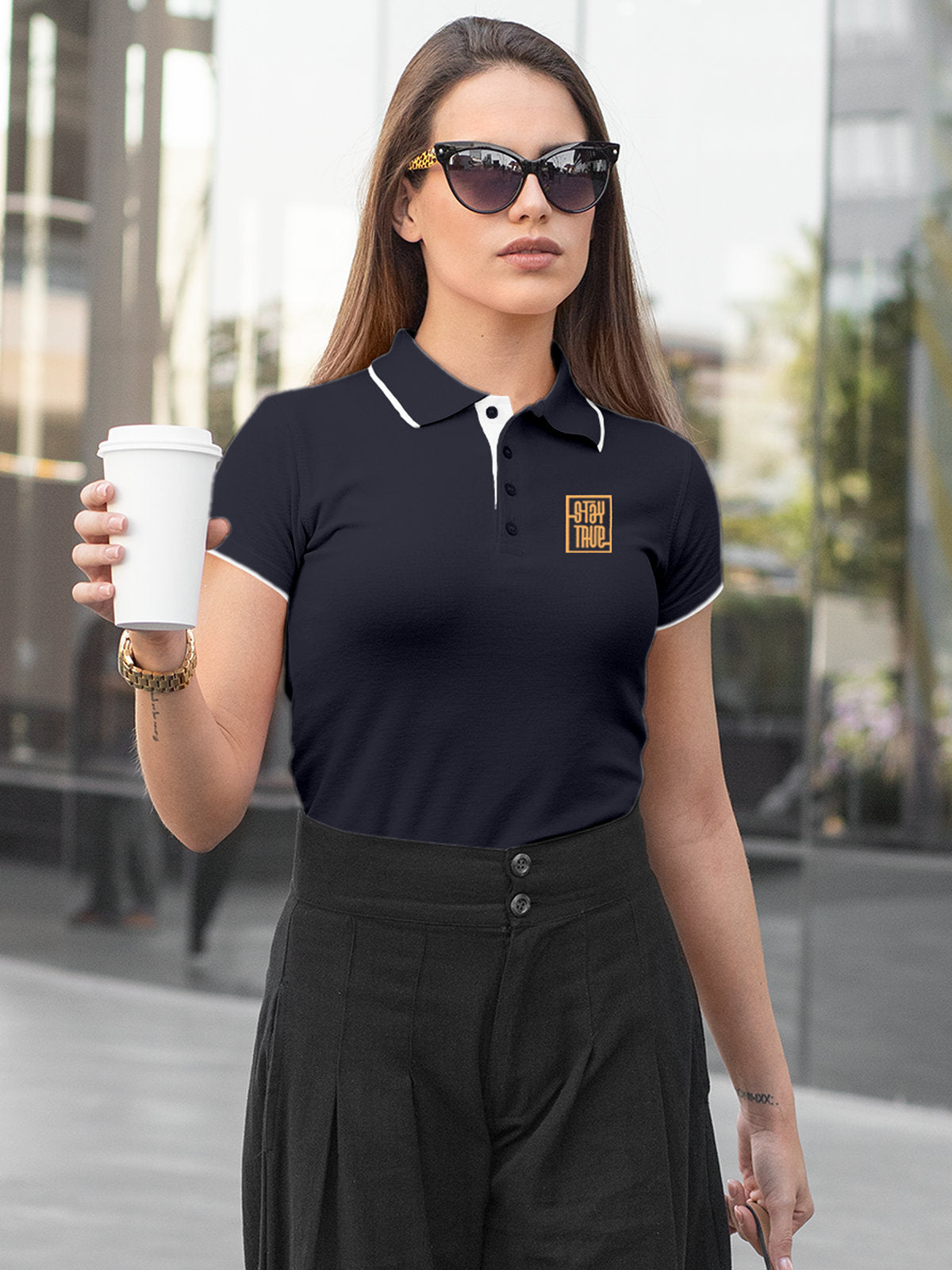 Model wearing Women's Navy Blue Polo T-shirt with Stay True, offering effortless style and premium comfort