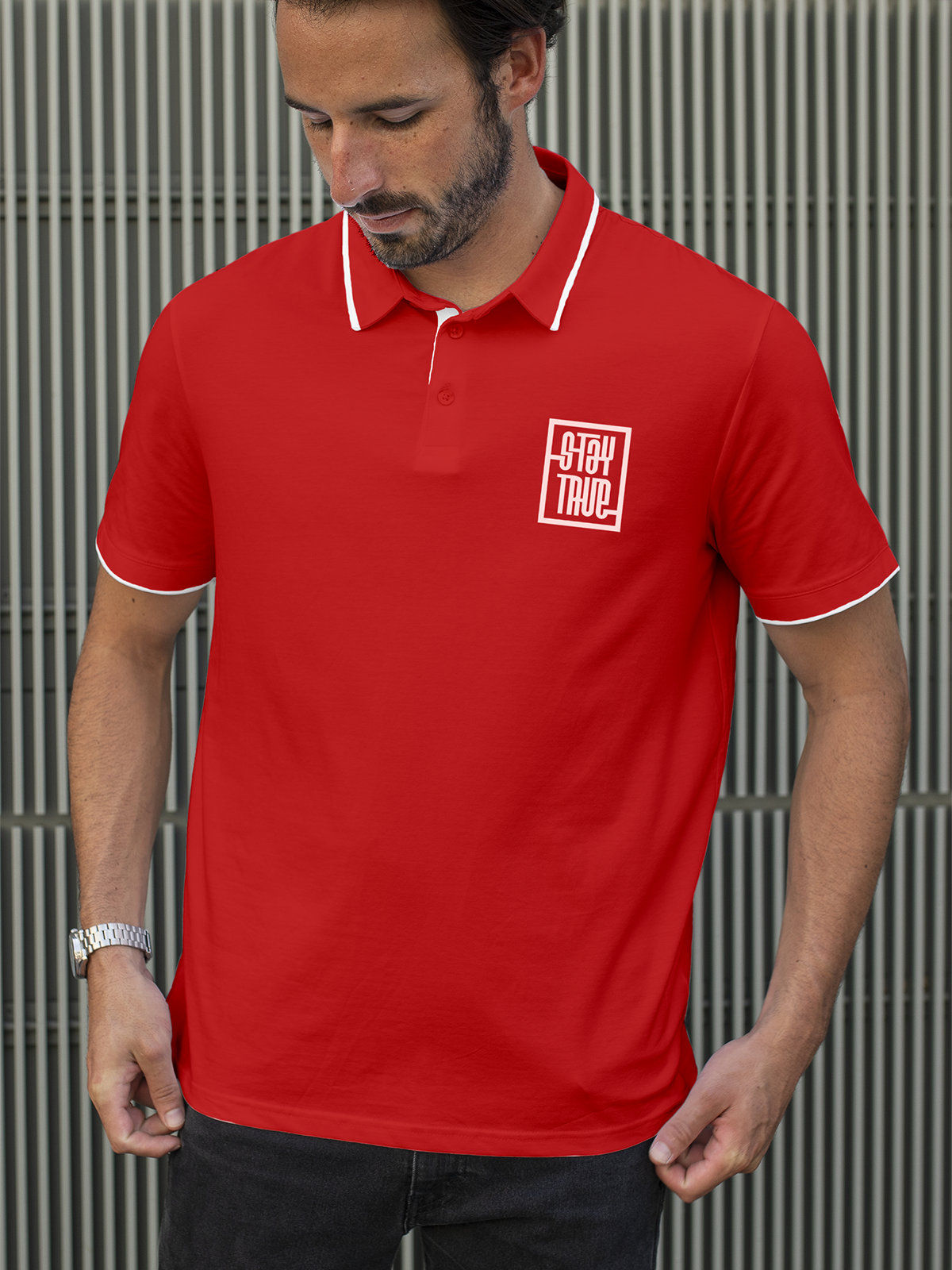 Model wearing Men's Red Polo T-shirt with 'Stay True' design, offering effortless style and premium comfort