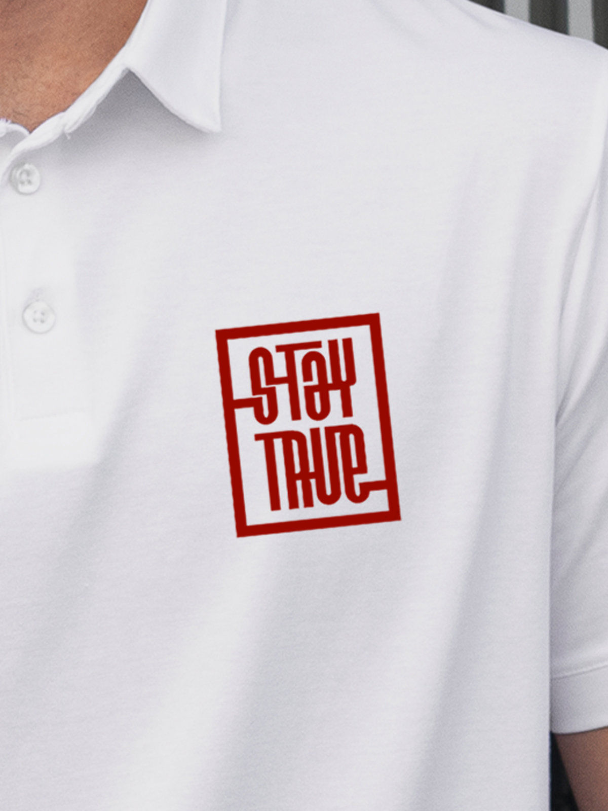 Close up of 'Stay True' design on Men's White Polo T-shirt, highlighting intricate details and vibrant print.