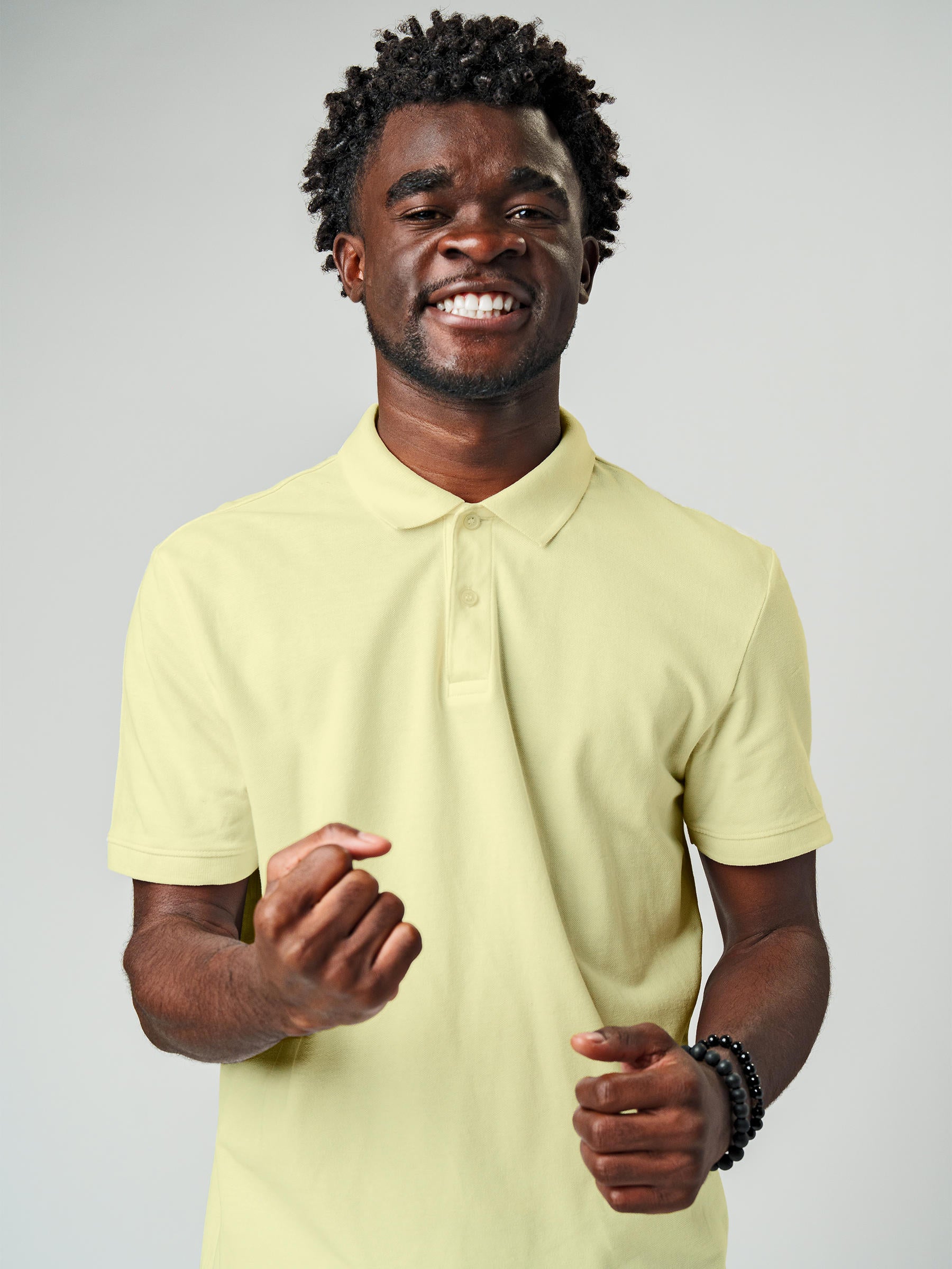 Model wearing Men's Plain Solid Yellow Polo T-shirt, offering effortless style and premium comfort