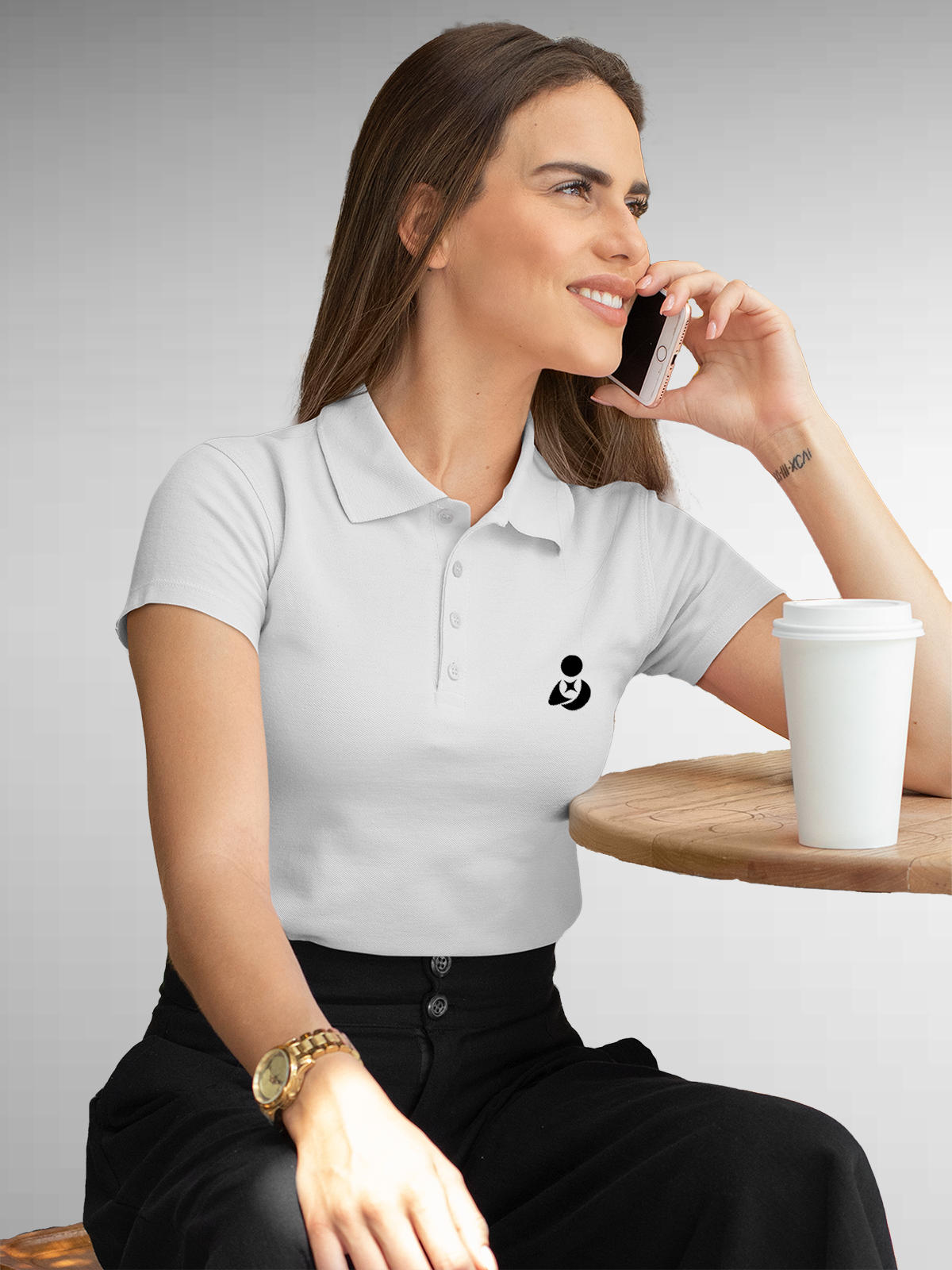 Model wearing Women's White Polo T-shirt with Fighterhero Logo, offering effortless style and premium comfort