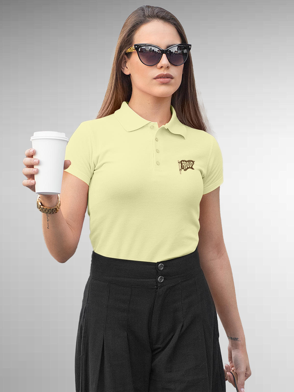Model wearing Women's Yellow Polo T-shirt with 'Proud' design, offering effortless style and premium comfort