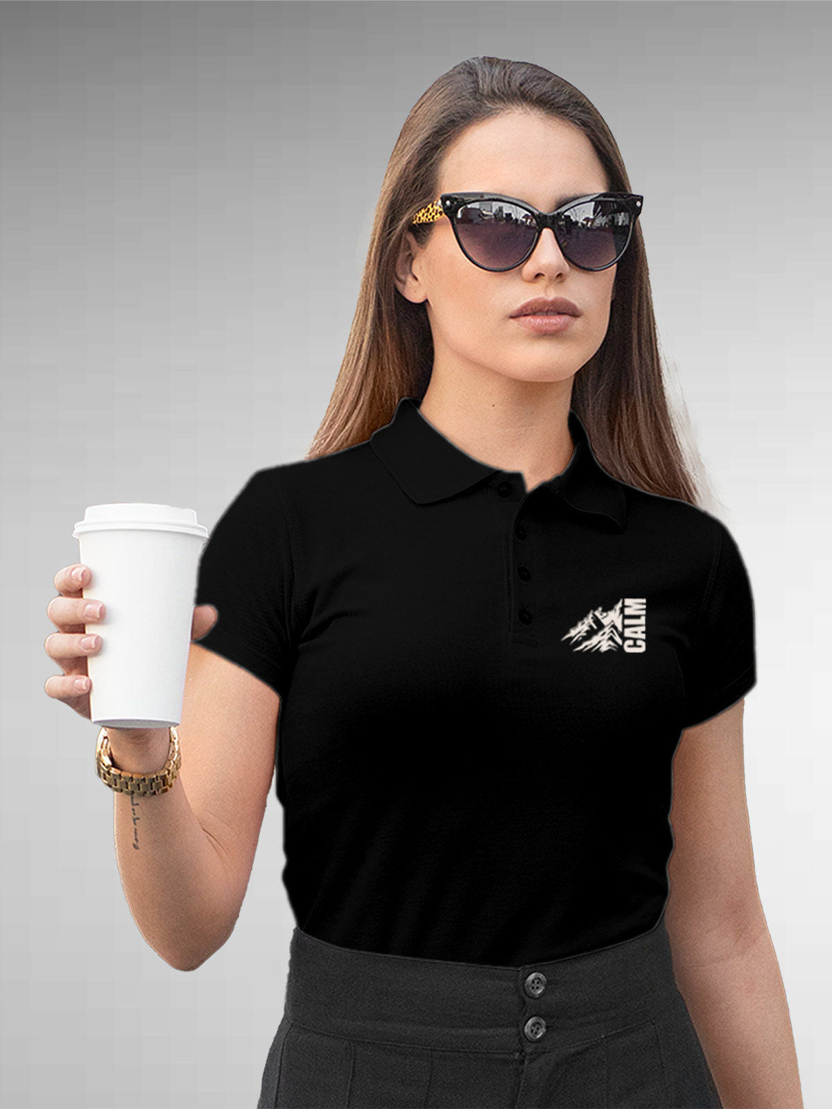 Model wearing Women's Black Polo T-shirt with 'Calm' design, offering effortless style and premium comfort