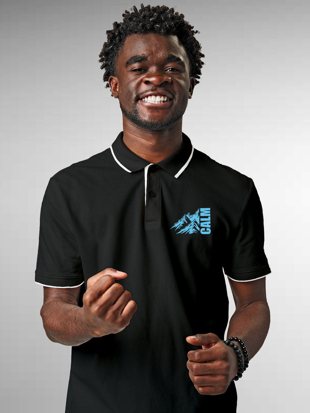 Model wearing Men's Dark Grey Polo T-shirt with 'Calm' design, offering effortless style and premium comfort