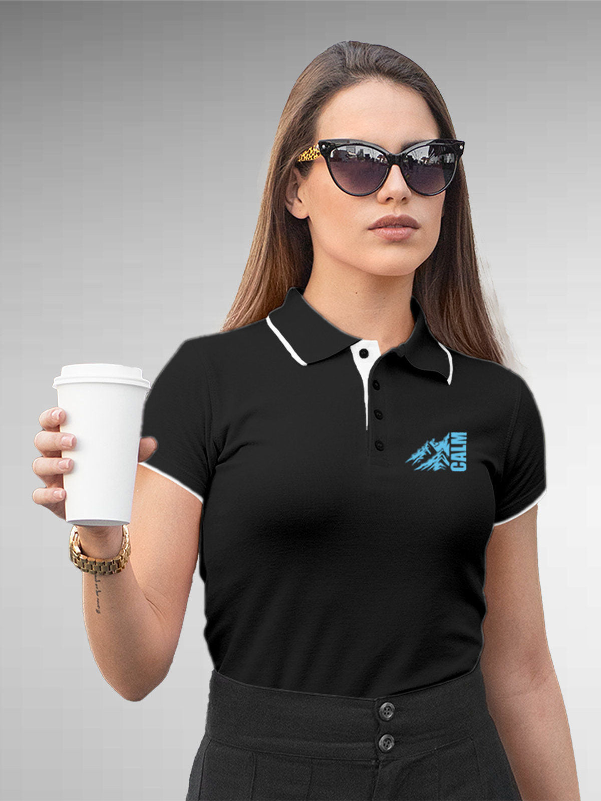 Model wearing Women's Dark Grey Polo T-shirt with 'Calm' design, offering effortless style and premium comfort