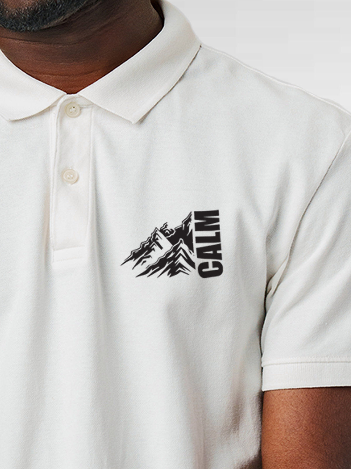 Close up of 'Calm' design on Men's White Polo T-shirt, highlighting intricate details and vibrant print.