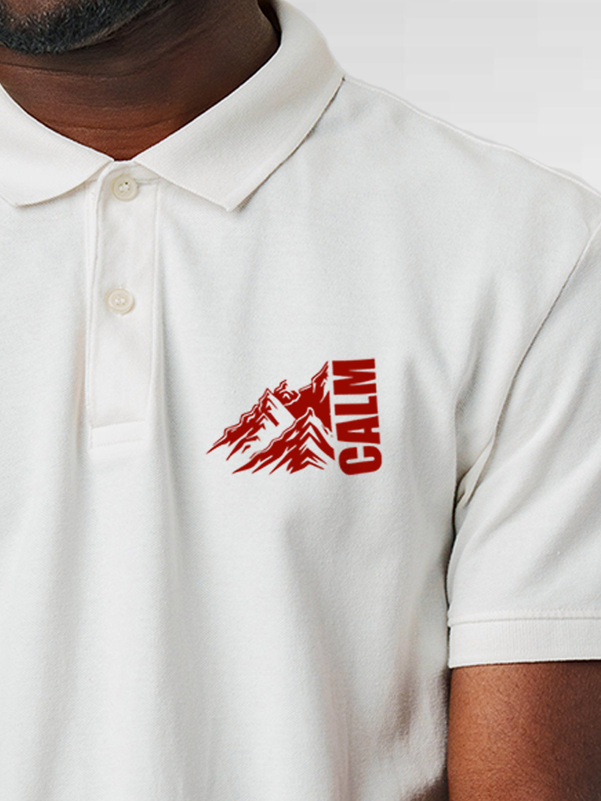 Close up of 'Calm' design on Men's White Polo T-shirt, highlighting intricate details and vibrant print.