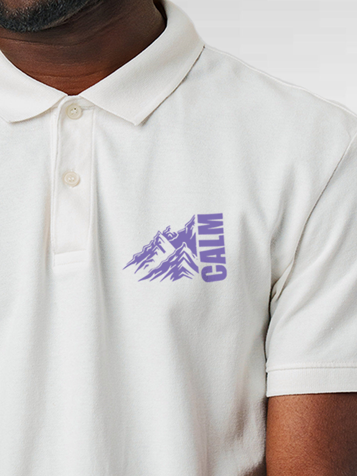 Close up of 'Calm' design on Men's White Polo T-shirt, highlighting intricate details and vibrant print.