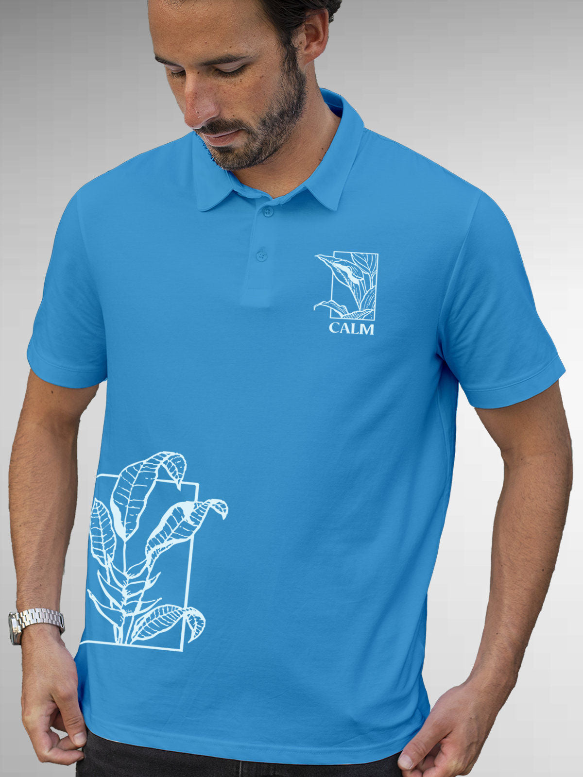 Model wearing Men's Blue Polo T-shirt with 'Calm' design, offering effortless style and premium comfort