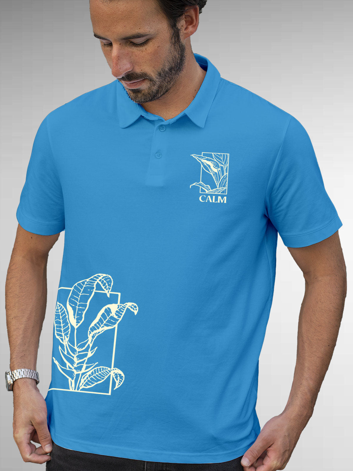 Model wearing Men's Blue Polo T-shirt with 'Calm' design, offering effortless style and premium comfort