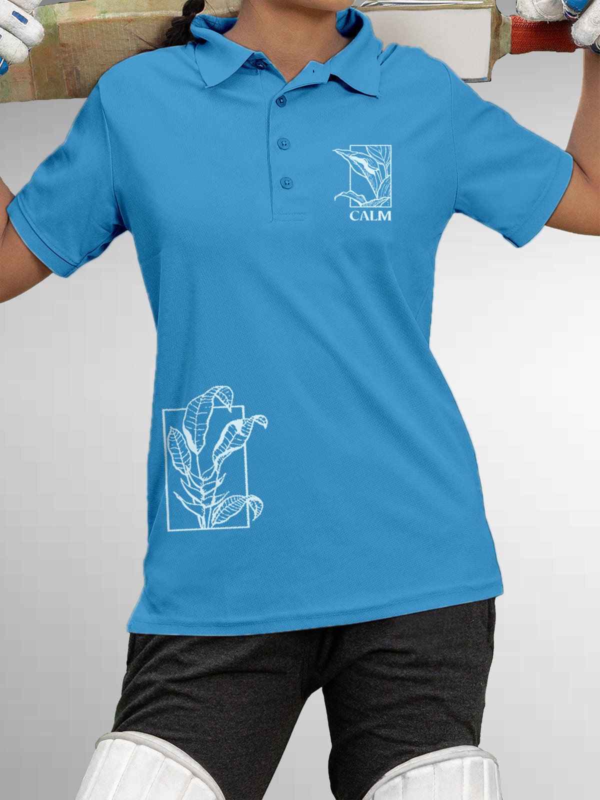 Model wearing Women's Blue Polo T-shirt with 'Calm' design, offering effortless style and premium comfort