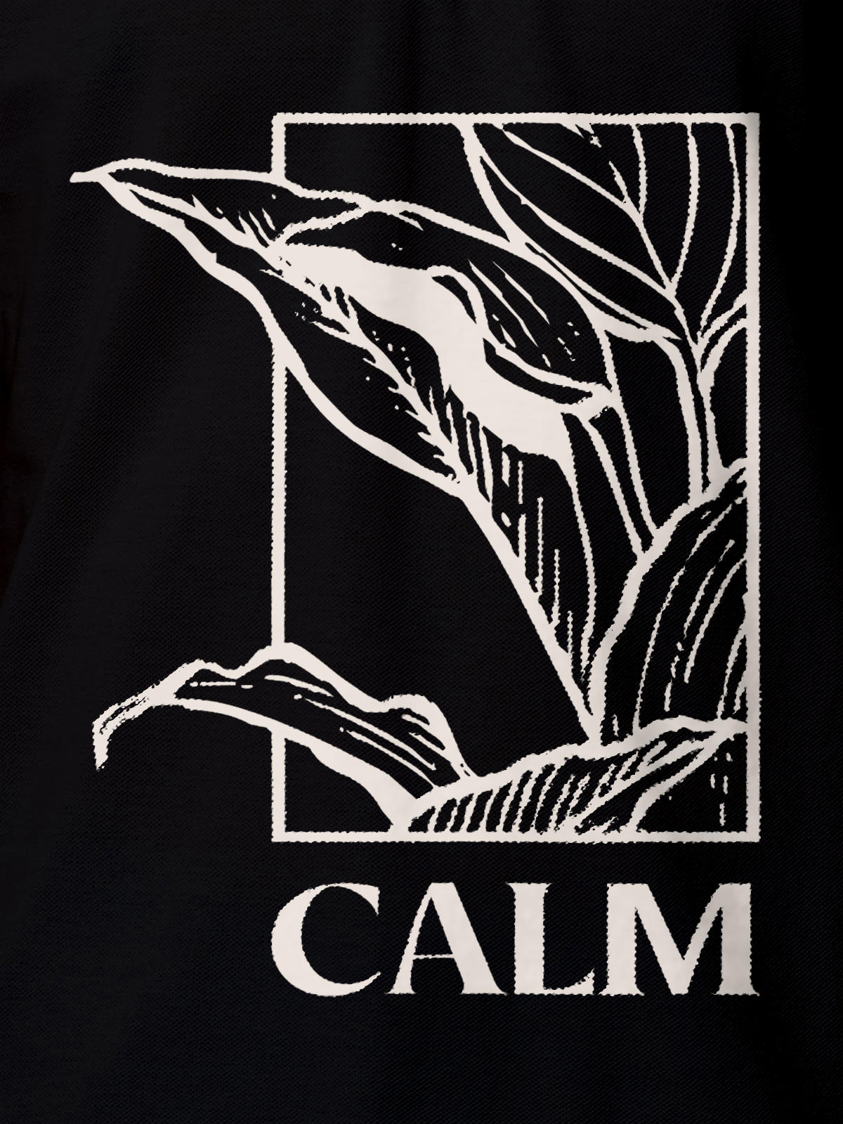 Close up of 'Calm' design on Men's Black Polo T-shirt, highlighting intricate details and vibrant print.