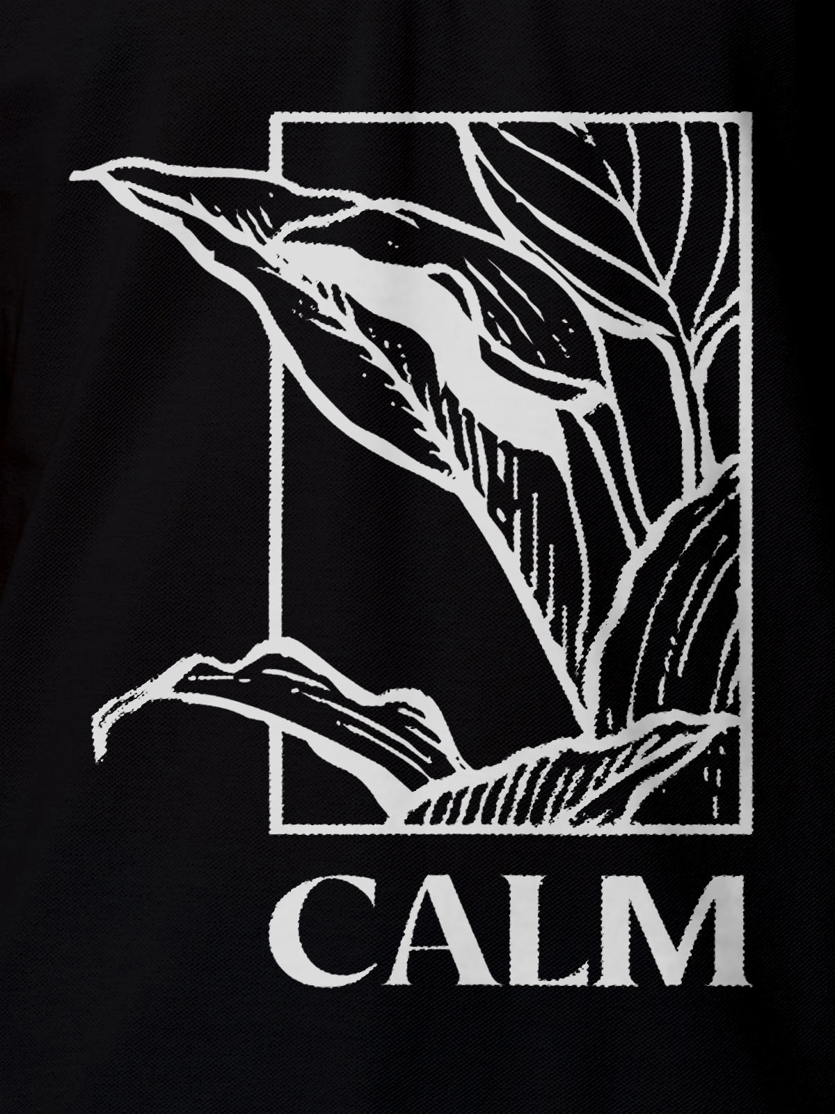 Close up of 'Calm' design on Men's Black Polo T-shirt, highlighting intricate details and vibrant print.
