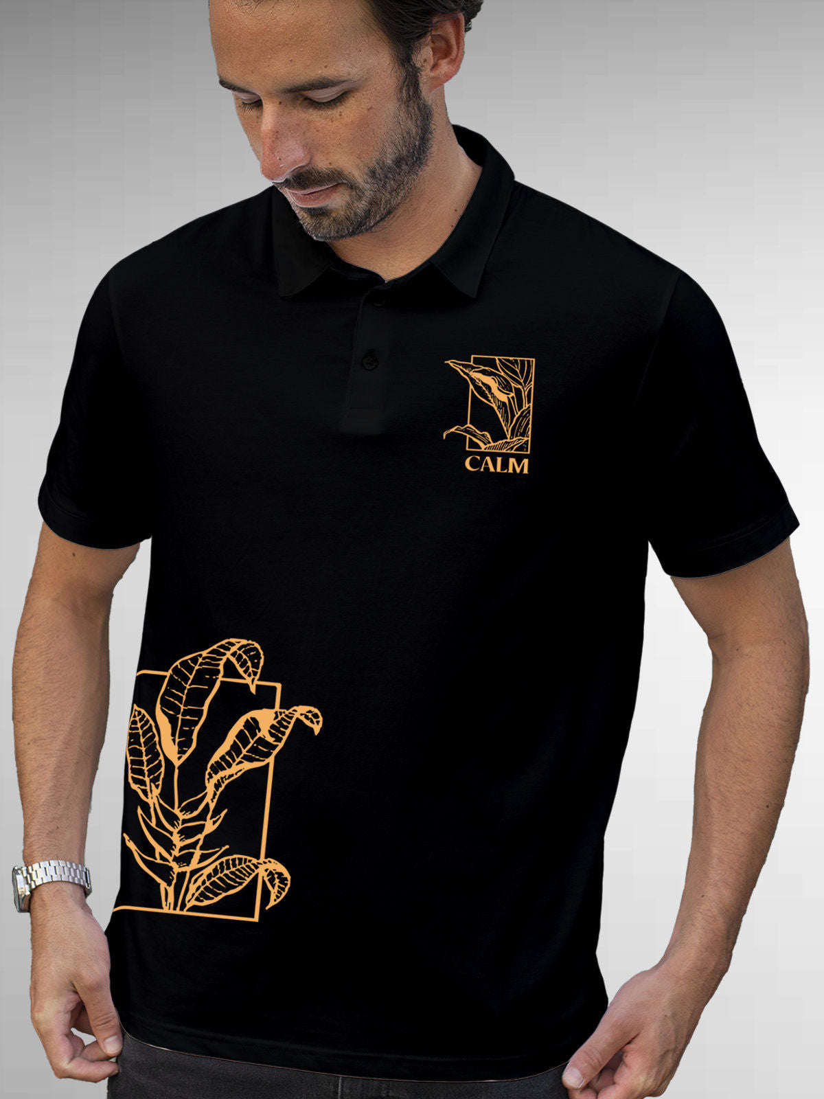 Model wearing Men's Black Polo T-shirt with 'Calm' design, offering effortless style and premium comfort