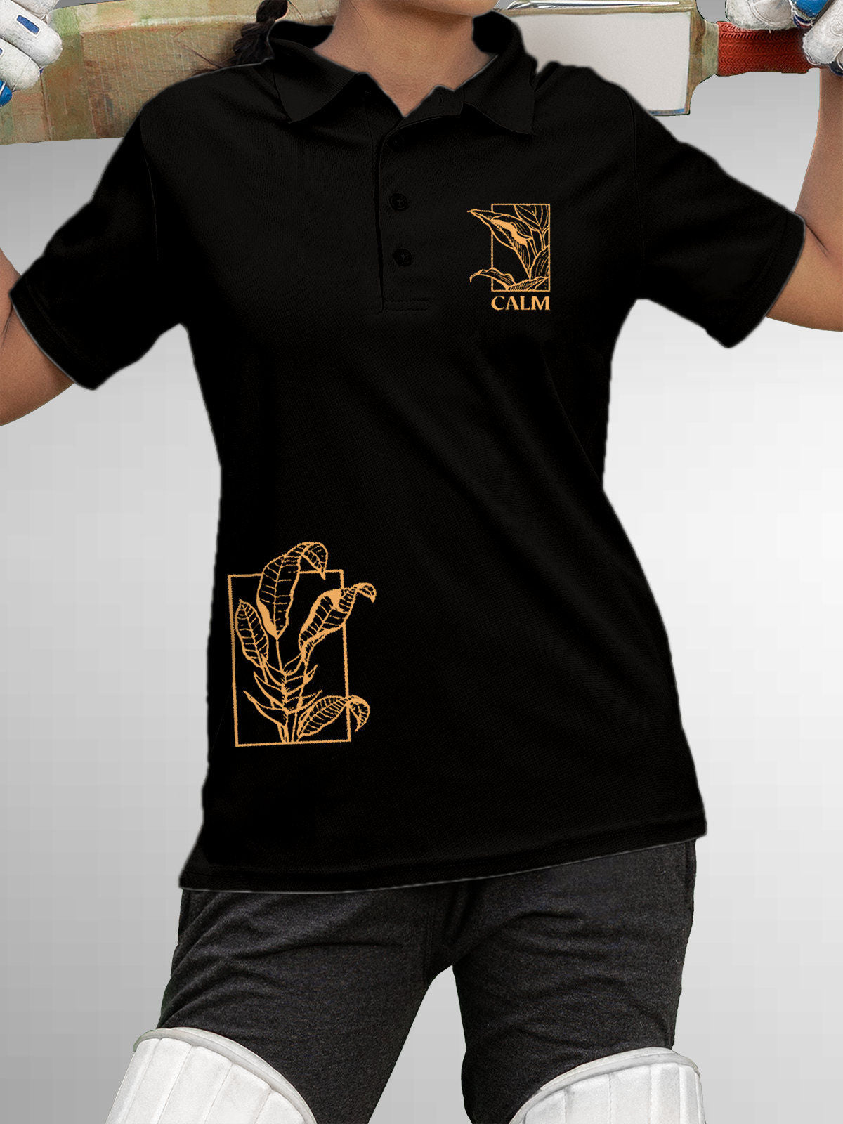 Model wearing Women's Black Polo T-shirt with 'Calm' design, offering effortless style and premium comfort