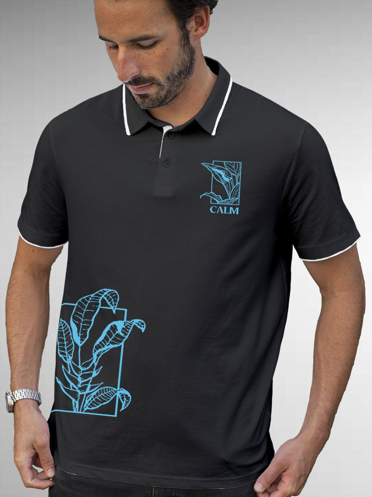 Model wearing Men's Dark Grey Polo T-shirt with 'Calm' design, offering effortless style and premium comfort
