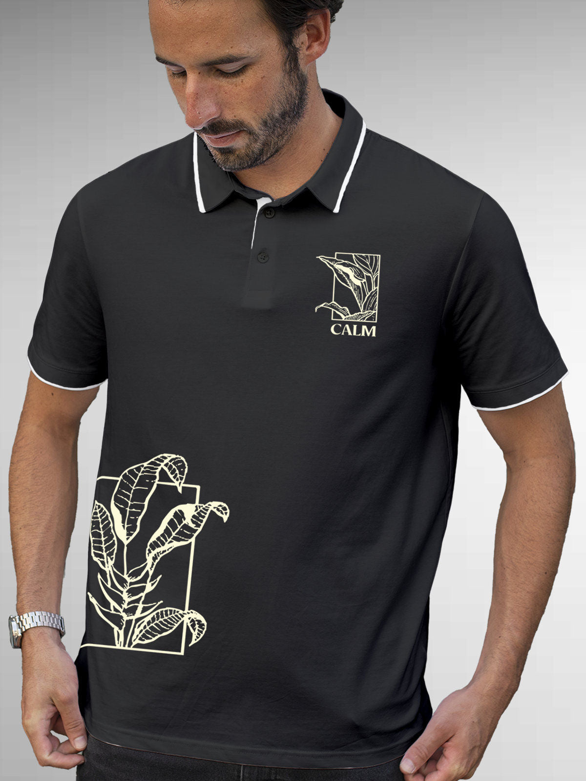 Model wearing Men's Dark Grey Polo T-shirt with 'Calm' design, offering effortless style and premium comfort