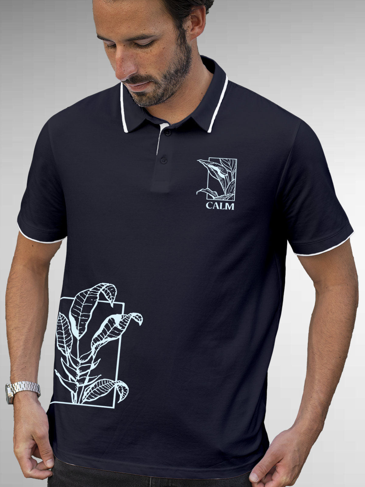 Model wearing Men's Navy Blue Polo T-shirt with 'Calm' design, offering effortless style and premium comfort