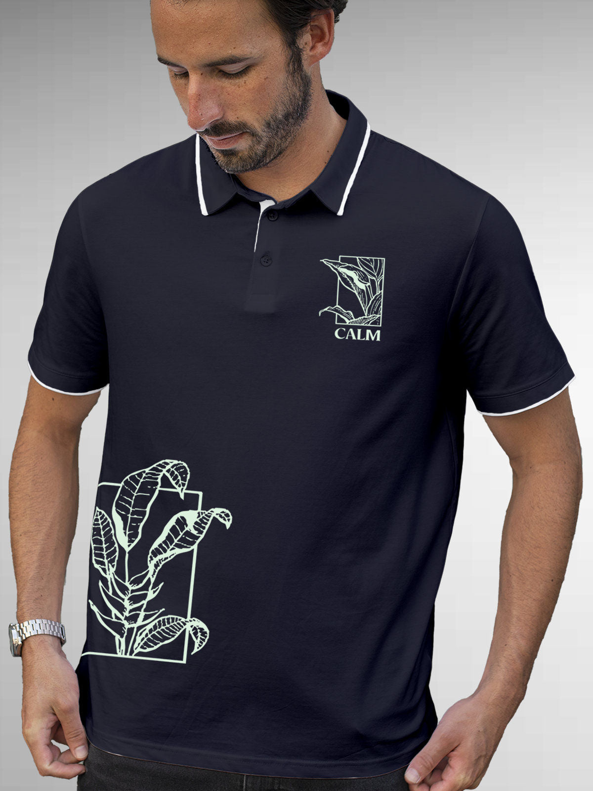 Model wearing Men's Navy Blue Polo T-shirt with 'Calm' design, offering effortless style and premium comfort