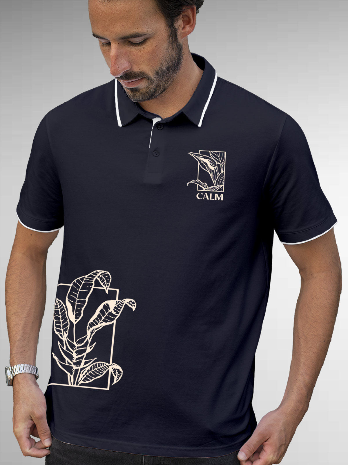 Model wearing Men's Navy Blue Polo T-shirt with 'Calm' design, offering effortless style and premium comfort