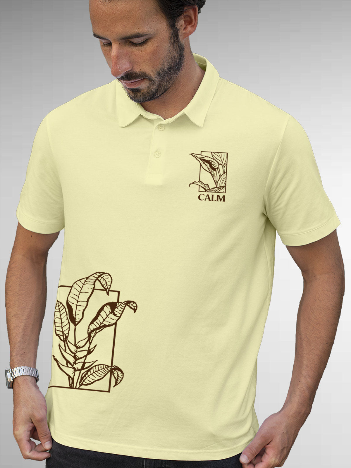 Model wearing Men's Yellow Polo T-shirt with 'Calm' design, offering effortless style and premium comfort