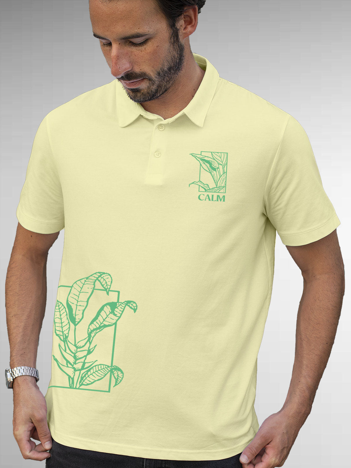Model wearing Men's Yellow Polo T-shirt with 'Calm' design, offering effortless style and premium comfort