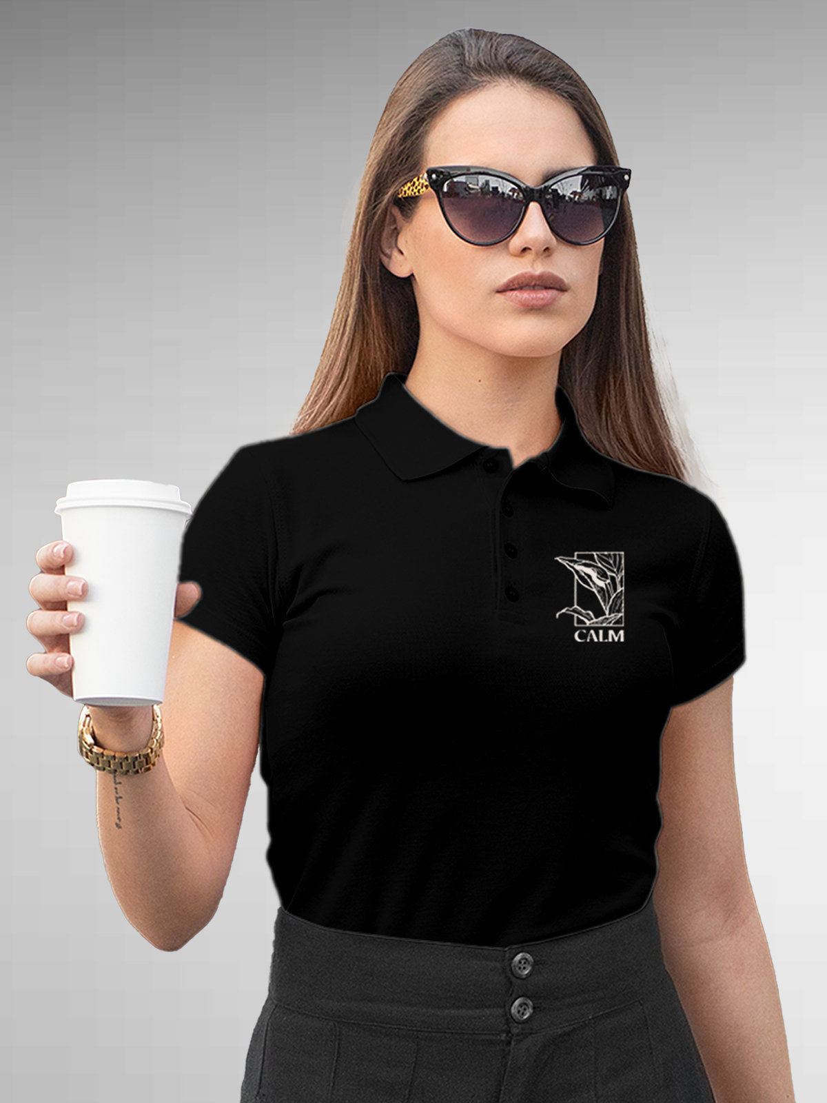 Model wearing Women's Black Polo T-shirt with 'Calm' design, offering effortless style and premium comfort