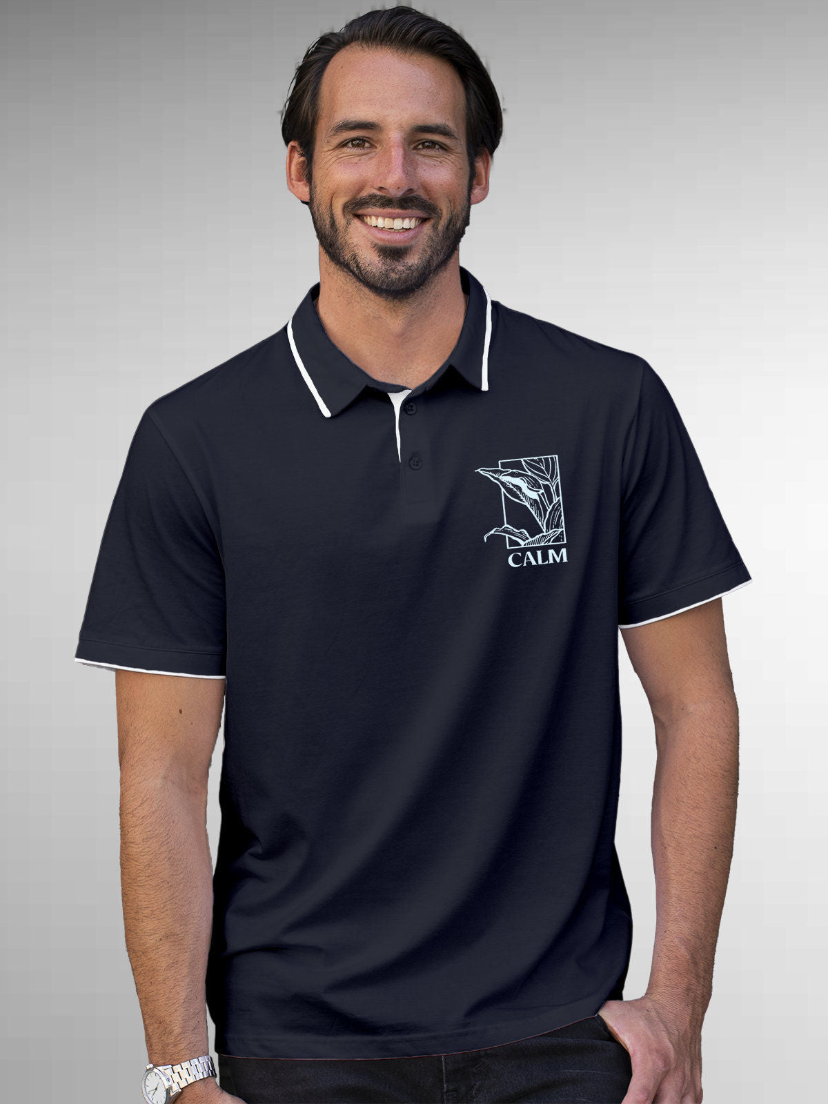 Model wearing Men's Navy Blue Polo T-shirt with 'Calm' design, offering effortless style and premium comfort