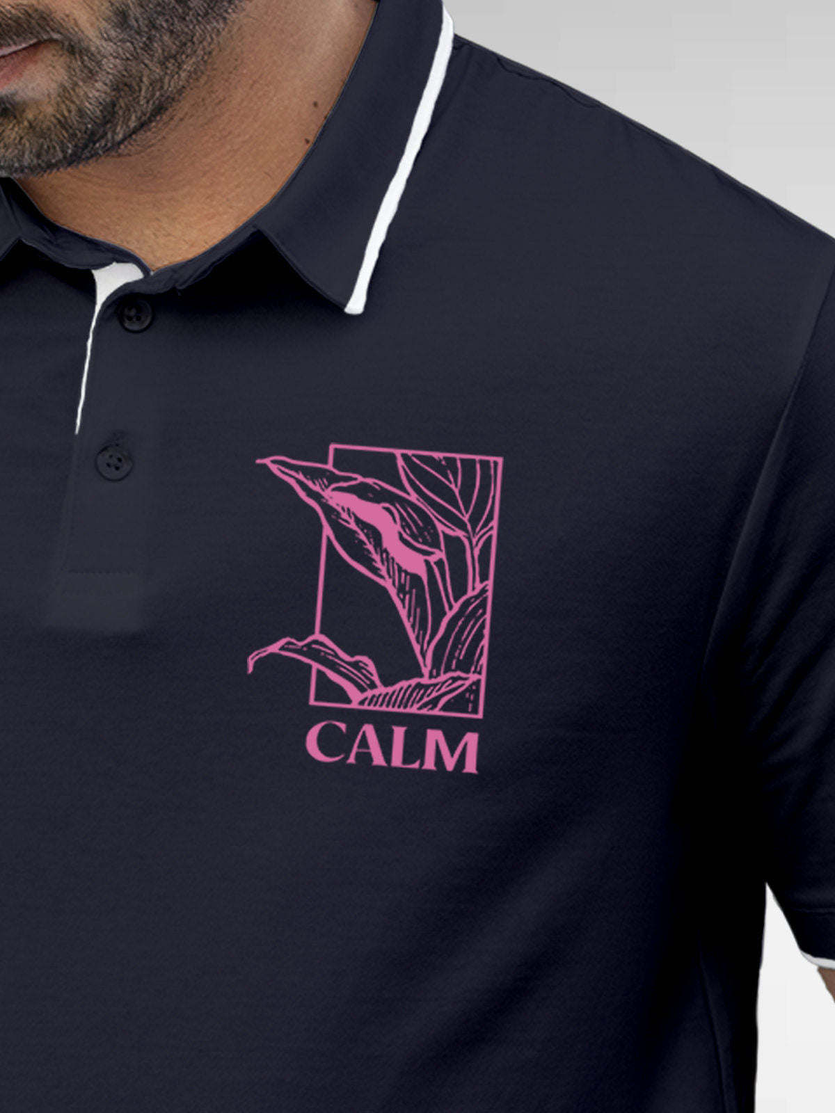 Close up of 'Calm' design on Men's Navy Blue Polo T-shirt, highlighting intricate details and vibrant print.