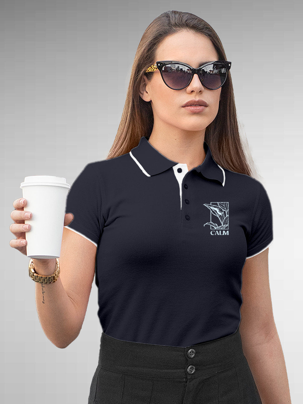 Model wearing Women's Navy Blue Polo T-shirt with 'Calm' design, offering effortless style and premium comfort