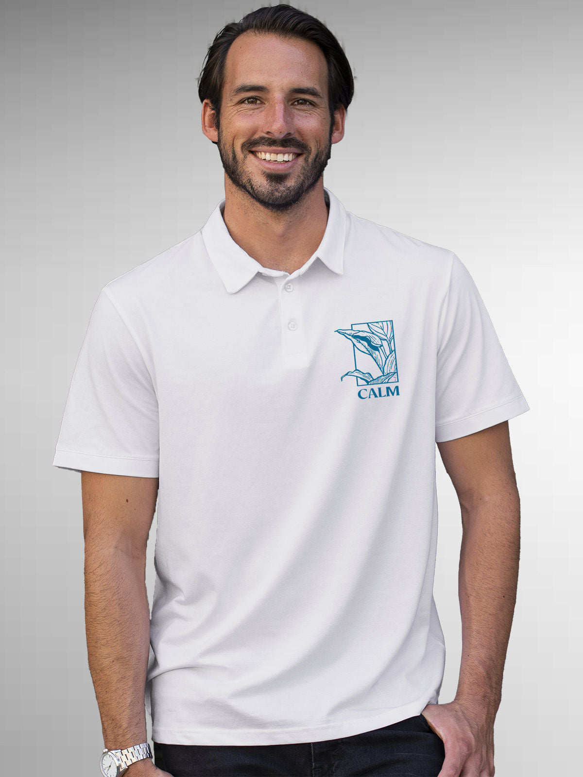 Model wearing Men's White Polo T-shirt with 'Calm' design, offering effortless style and premium comfort