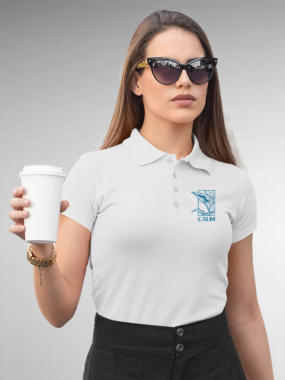 Model wearing Women's White Polo T-shirt with 'Calm' design, offering effortless style and premium comfort