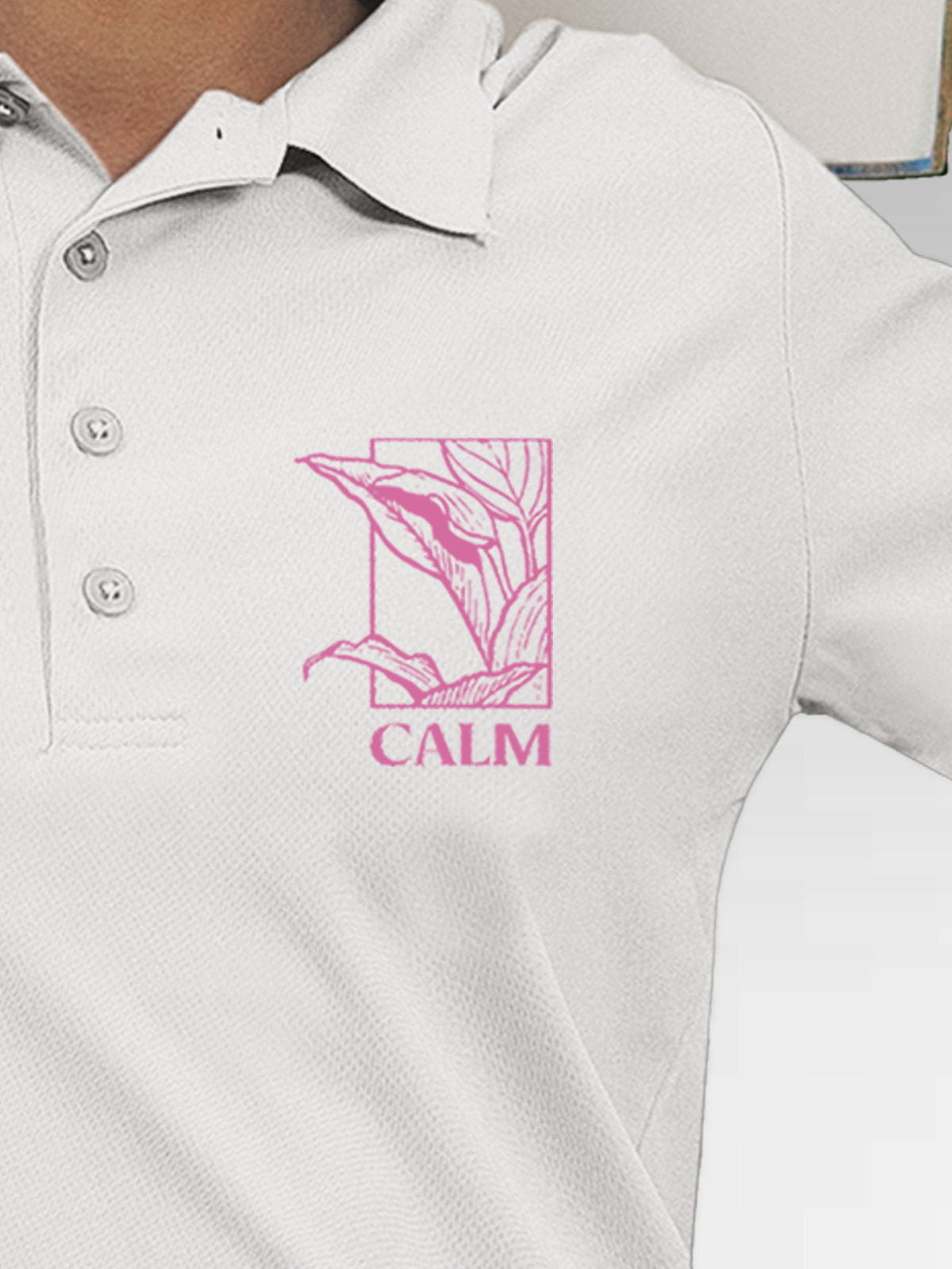 Close up of 'Calm' design on Women's White Polo T-shirt, highlighting intricate details and vibrant print.
