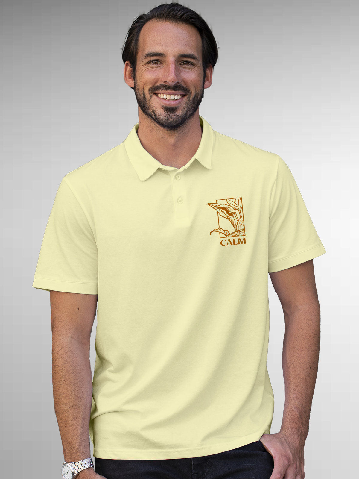 Model wearing Men's Yellow Polo T-shirt with 'Calm' design, offering effortless style and premium comfort