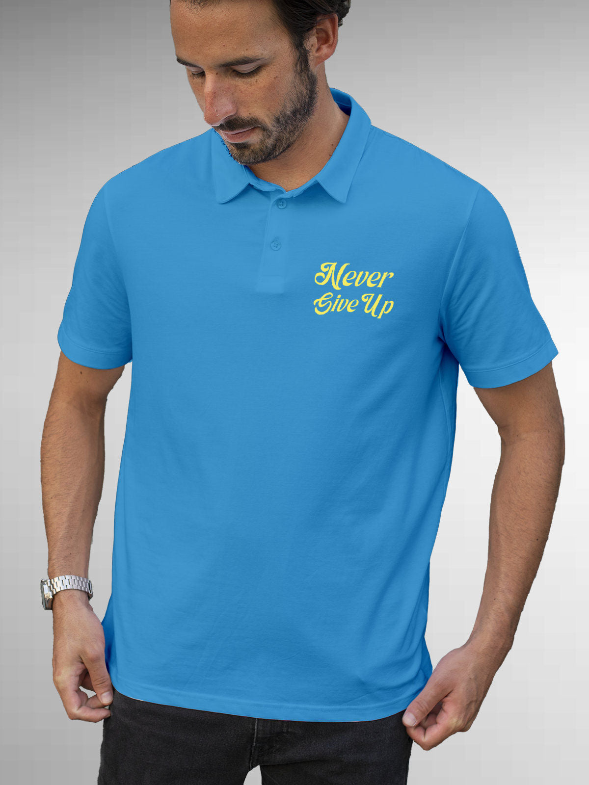 Model wearing Men's Blue Polo T-shirt with 'Never Give Up' design, offering effortless style and premium comfort
