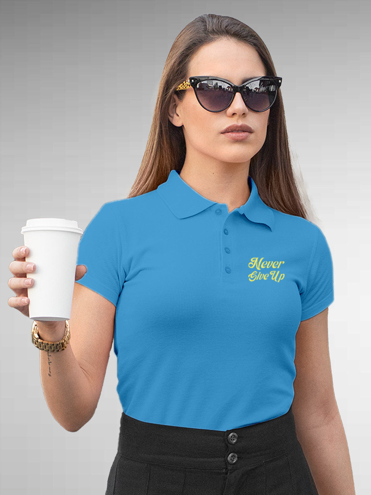 Model wearing Women's Blue Polo T-shirt with 'Never Give Up' design, offering effortless style and premium comfort