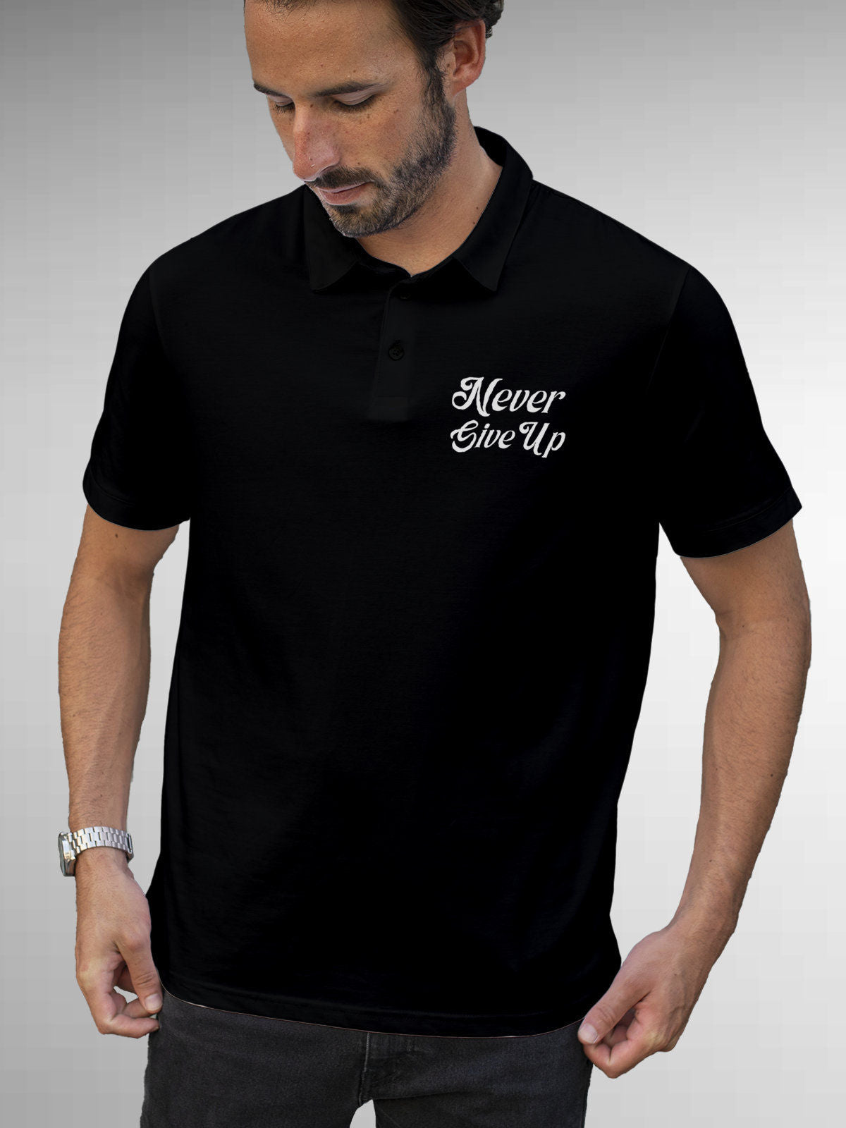 Model wearing Men's Black Polo T-shirt with 'Never Give Up' design, offering effortless style and premium comfort