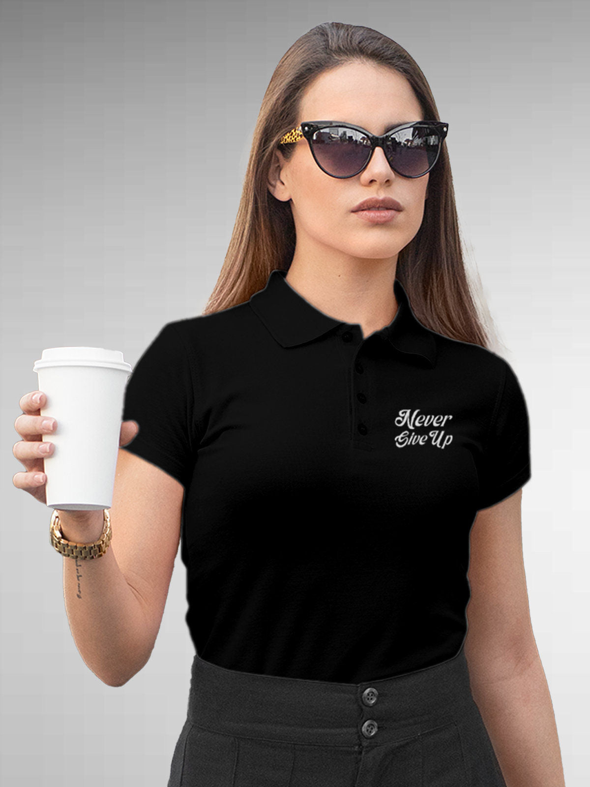 Model wearing Women's Black Polo T-shirt with 'Never Give Up' design, offering effortless style and premium comfort