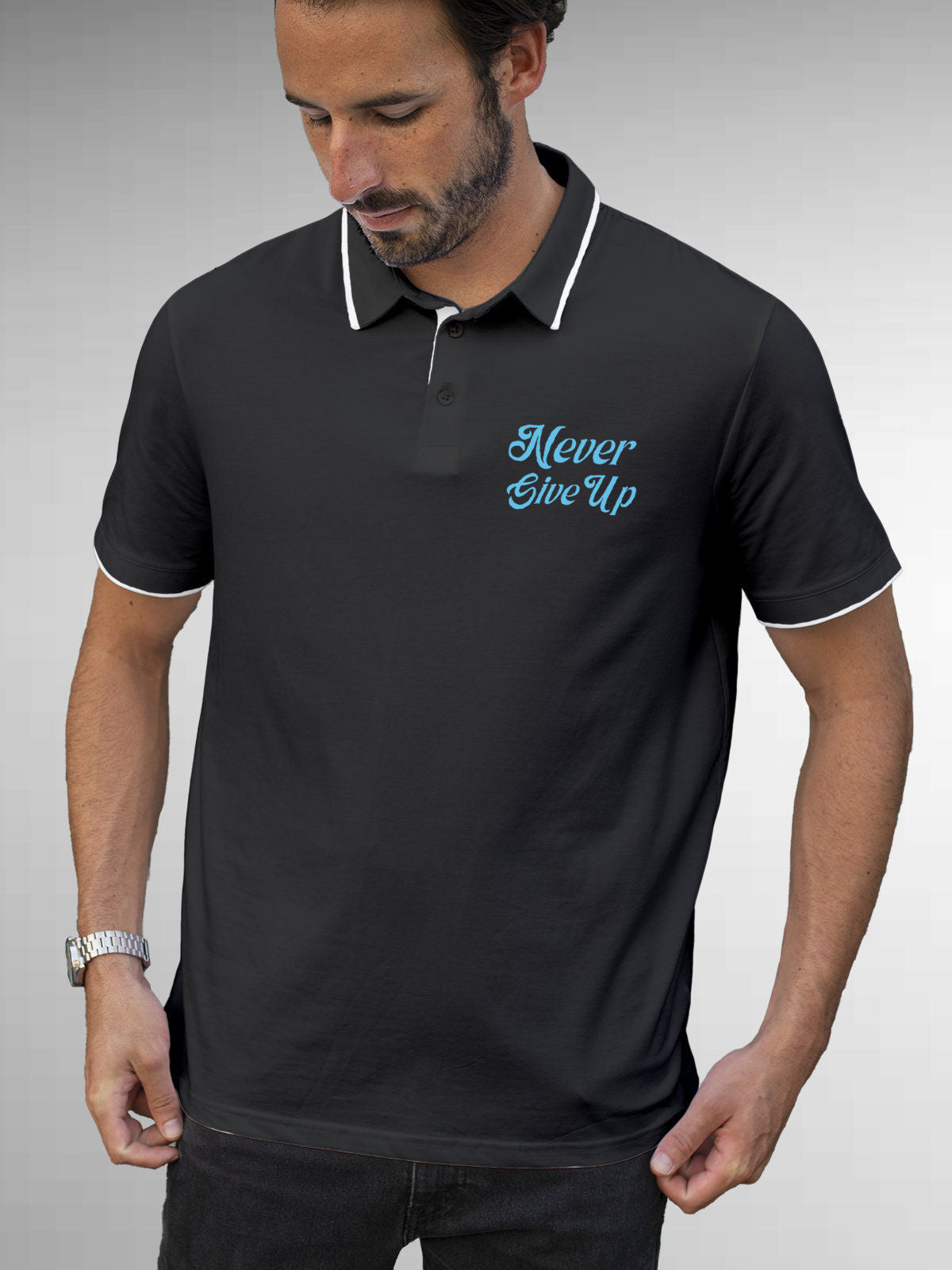 Model wearing Men's Dark Grey Polo T-shirt with 'Never Give Up' design, offering effortless style and premium comfort