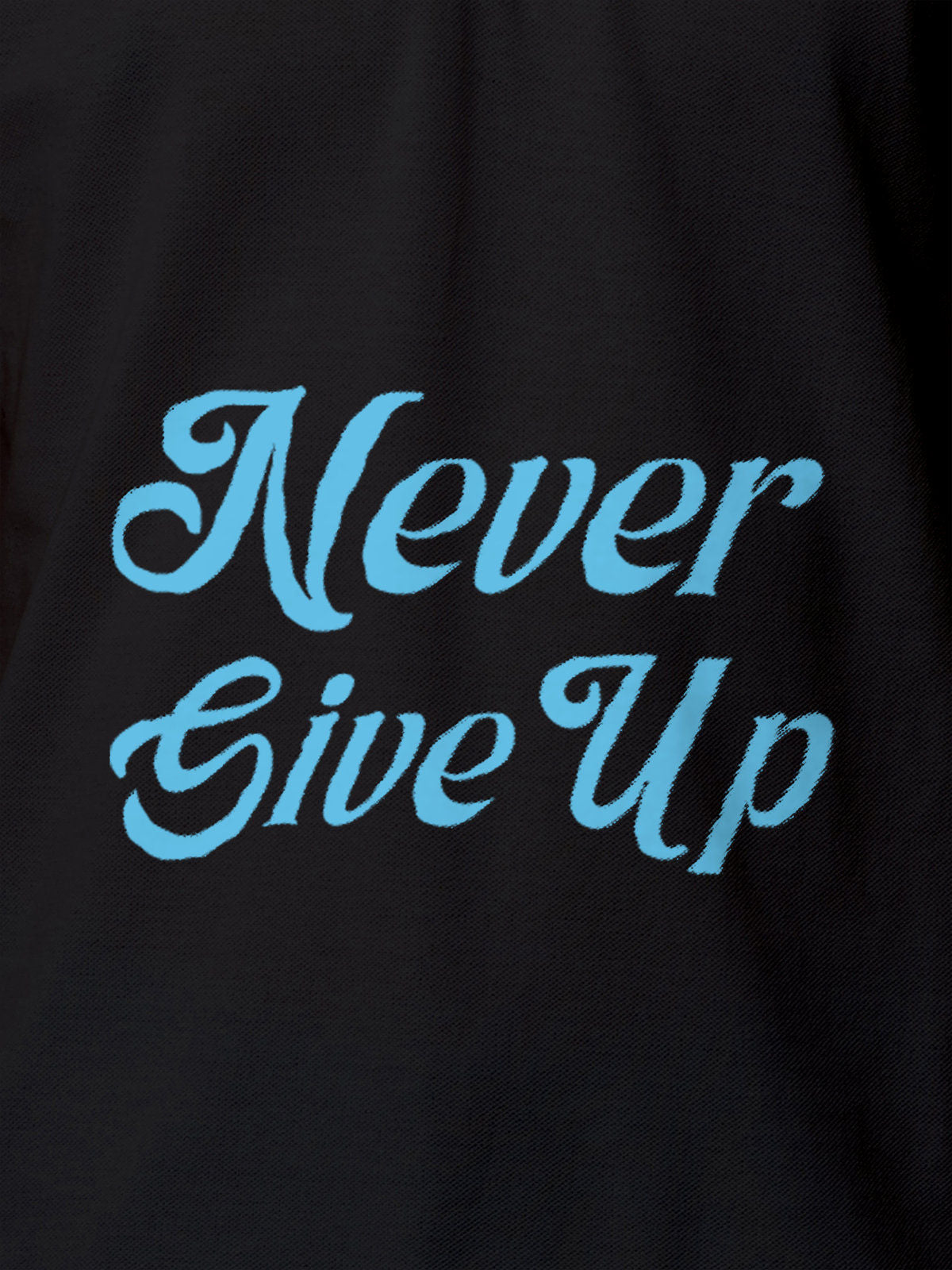 Close up of 'Never Give Up' design on Men's Dark Grey Polo T-shirt, highlighting intricate details and vibrant print.